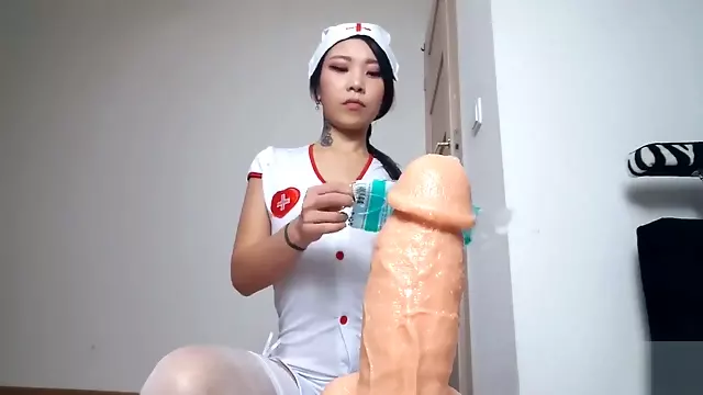 ASIAN NURSE GIVES DILDO HANDJOB WITH SURGICAL MASK AND GLOVES