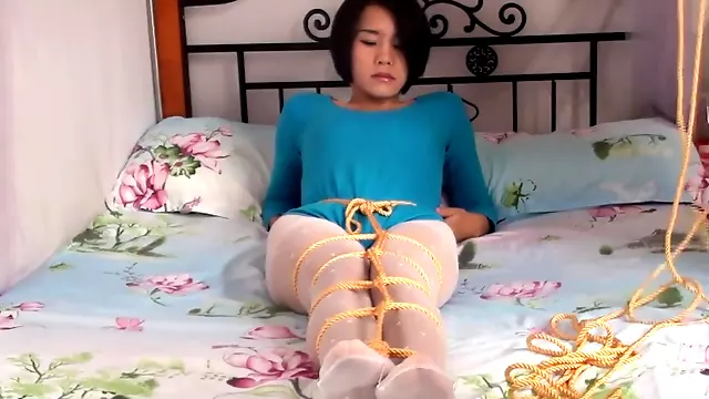 Asian Girl Encased In Nylon