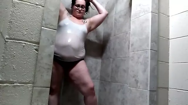 BBW gets her clothes all wet in public shower