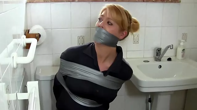 A Hot Milf Gets Bound With Duct Tape In The Toilet. Full Video